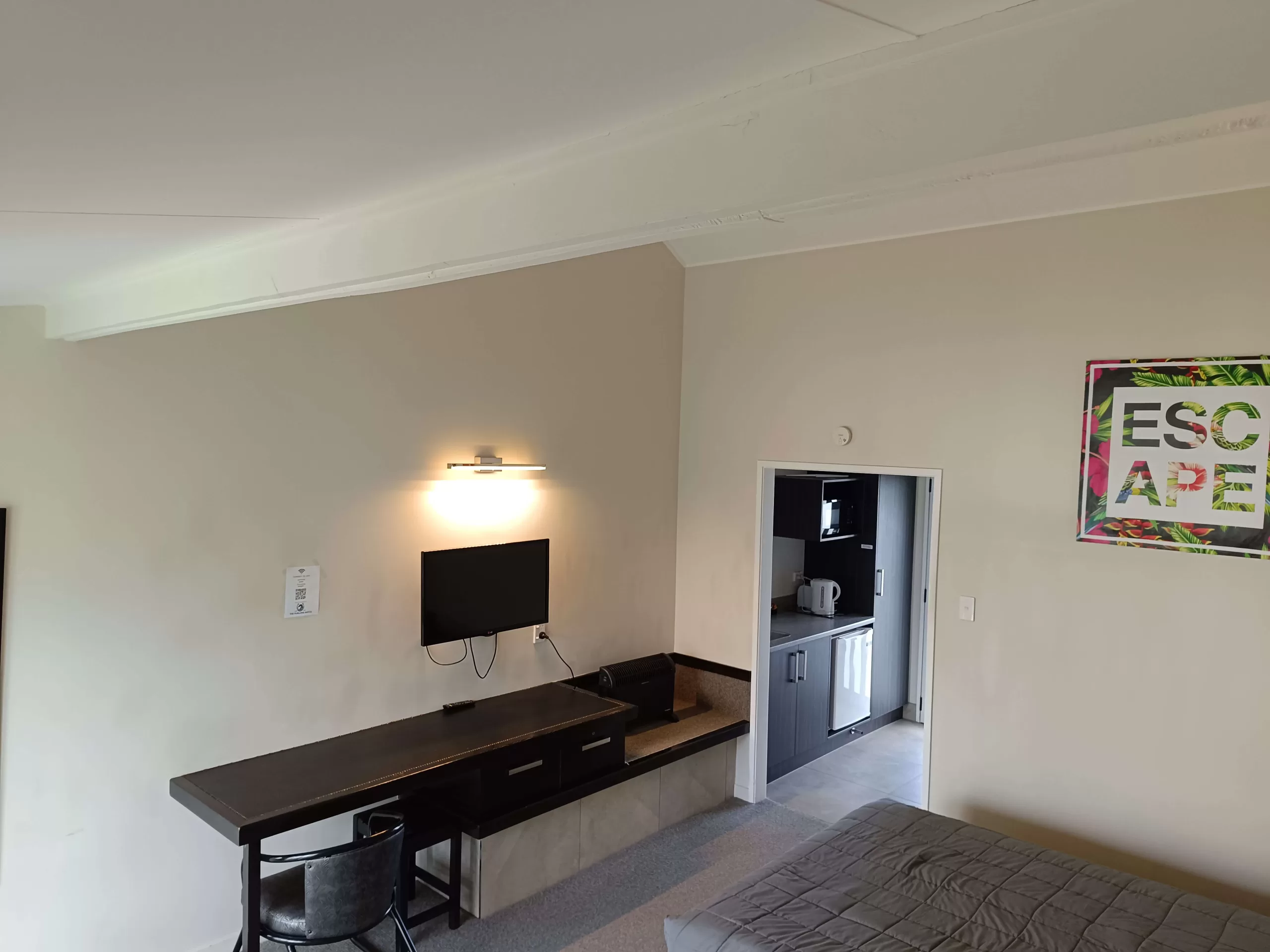 Private kitchenette and work desk in a studio room at The Furlong Motel